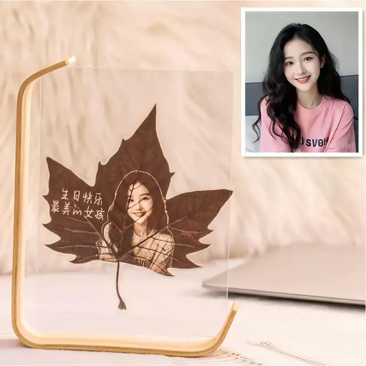 L-shaped acrylic photo frame with personalized leaf art and a custom portrait.